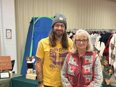 Nick and his mom at a craft show