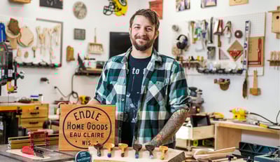 Nick standing at his workbench